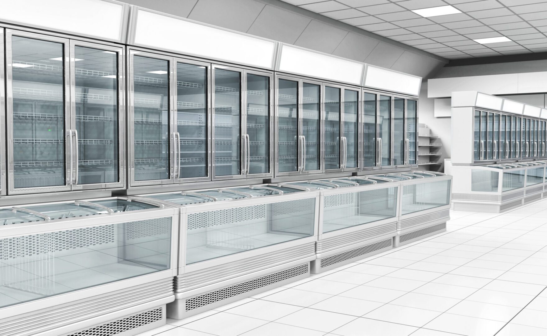 Interior empty supermarket with showcases freezer A large commercial freezer with many glass doors.