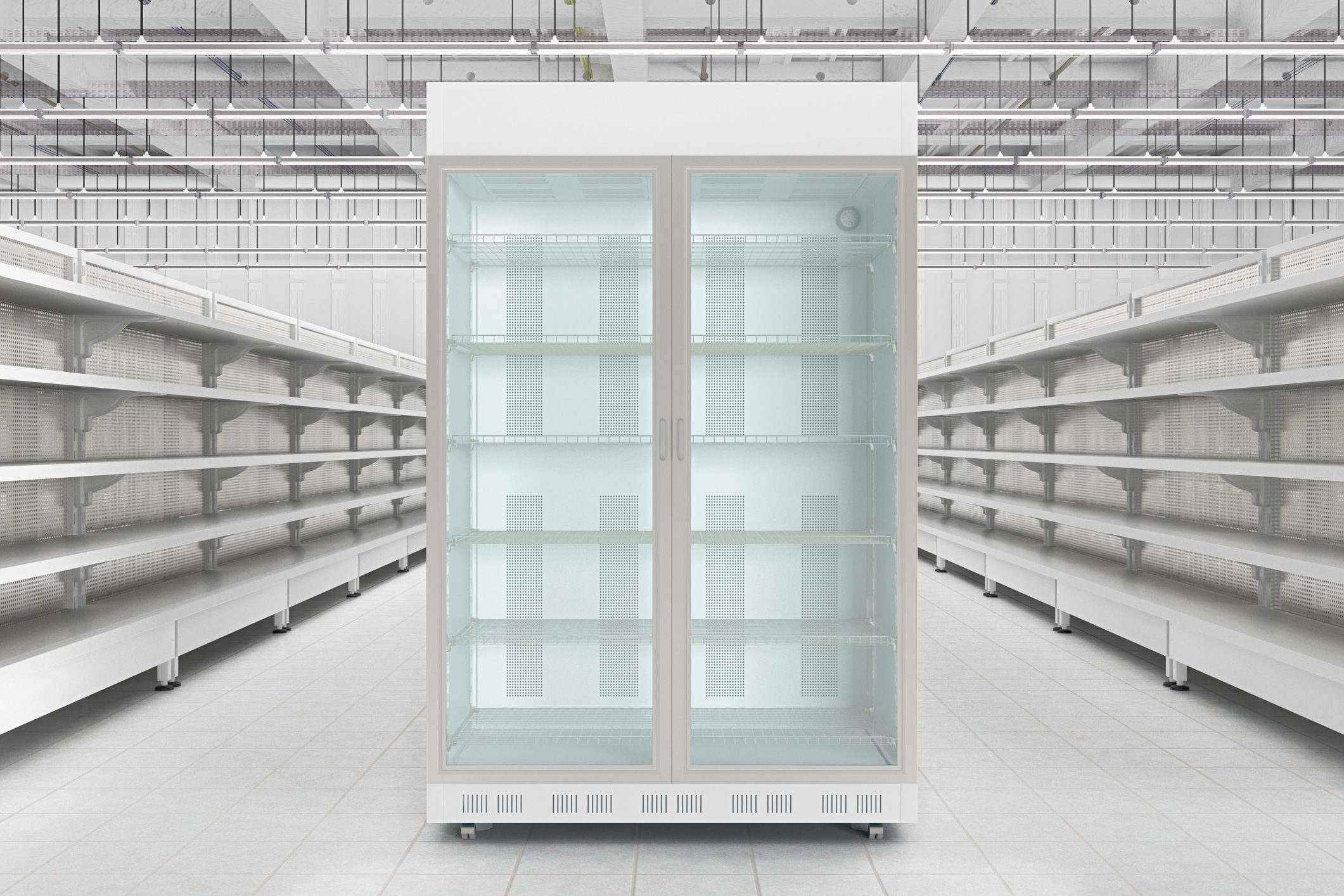 A large white refrigerator in an empty store.